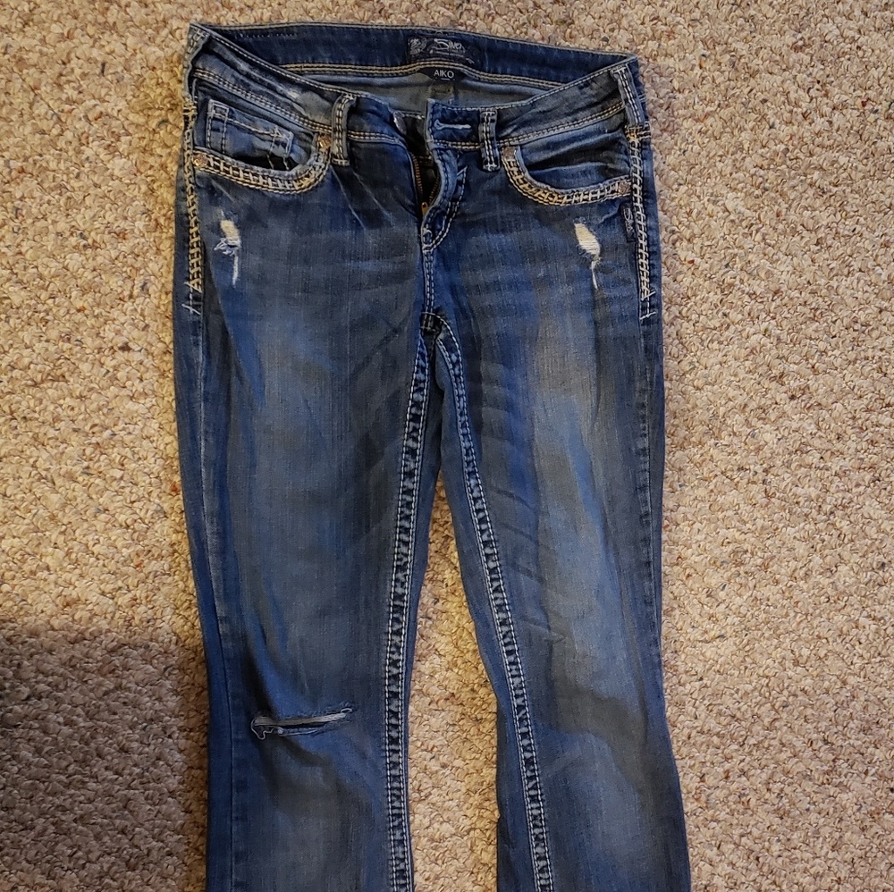 Silver distressed bootcut jeans